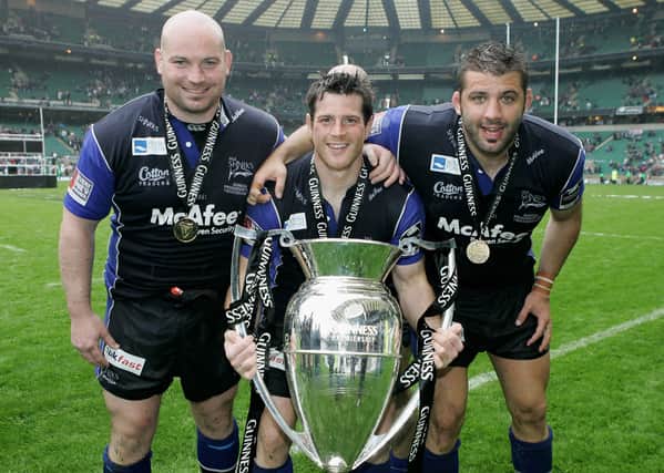(L to R) The Sale Front Row of Stuart Turner, Andy Titterrell and Lionel Faure pose with the trophy following their team’s victory during the Guinness Premiership Final between Sale Sharks and Leicester Tigers at Twickenham on May 27, 2006 Credit: Getty