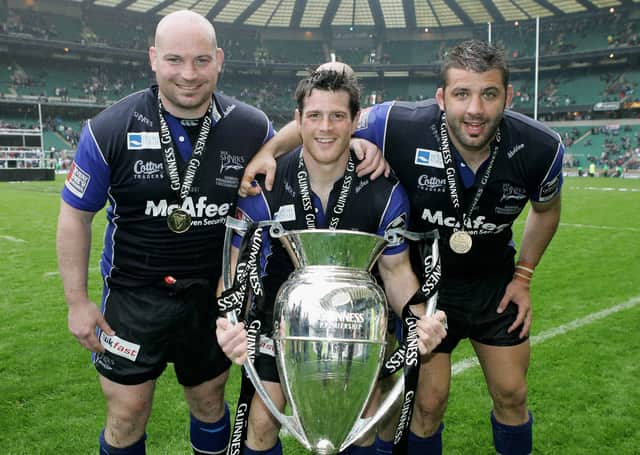 <p>(L to R) The Sale Front Row of Stuart Turner, Andy Titterrell and Lionel Faure pose with the trophy following their team’s victory during the Guinness Premiership Final between Sale Sharks and Leicester Tigers at Twickenham on May 27, 2006 Credit: Getty</p>