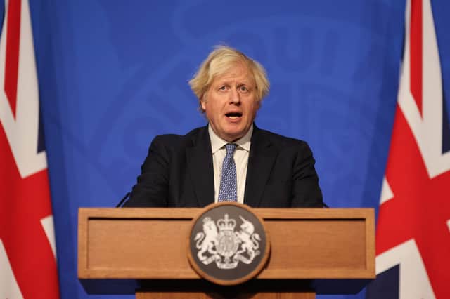 Boris Johnson has moved England into ‘Plan B’ restrictions amid fears over surging Covid cases and the spread of the Omicron variant. (Credit: Getty)