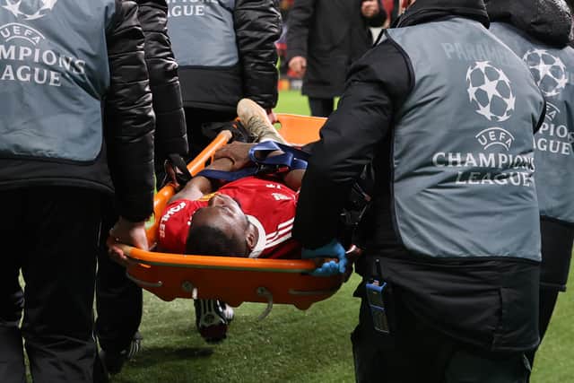 Wan-Bissaka was taken off on a stretcher after the game. Credit: Getty.