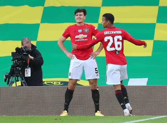 Harry Maguire and Mason Greenwood in an FA Cup tie against Norwich City last year Credit: Getty