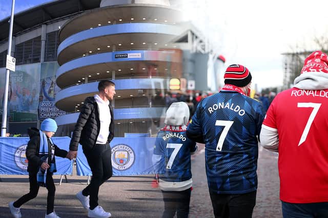 Manchester City and Manchester United fans Credit: Getty