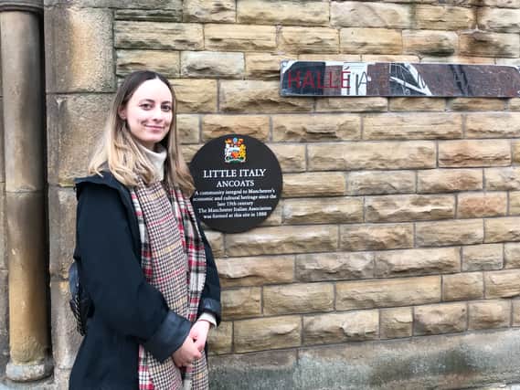 Lily Mott with the plaque commemorating the Italian community in Ancoats