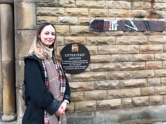 <p>Lily Mott with the plaque commemorating the Italian community in Ancoats</p>
