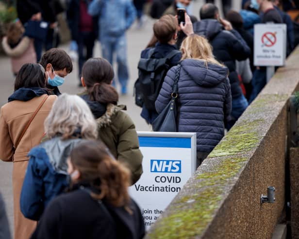 Some Covid drop-in centres have experienced queues but the NHS says it will work seven days a week to deliver (Image: Getty Images)