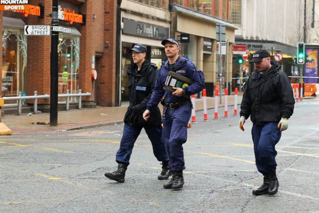 Police at the scene on Monday on Deansgate in Manchester Credit: SWNS