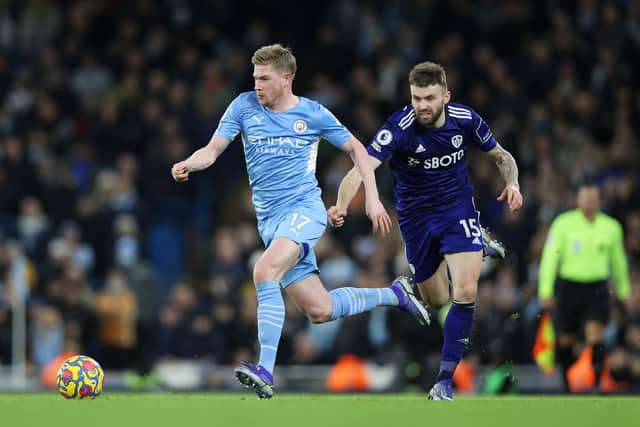 Kevin De Bruyne of Manchester City battles for possession with Stuart Dallas of Leeds United Credit: Getty 