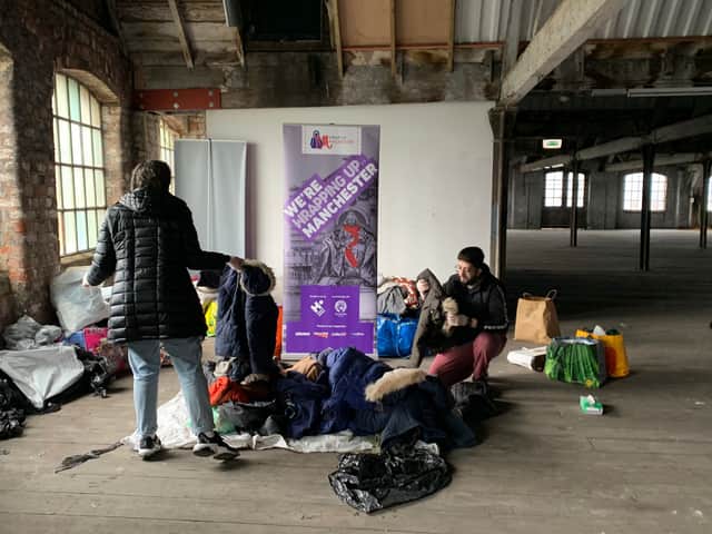 Volunteers from the Human Appeal sort through coats donated to Wrap Up