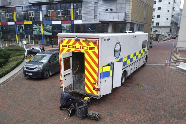 Police search teams hunt for missing Charley Gadd, near the Lowry Hotel, Manchester Credit: SWNS