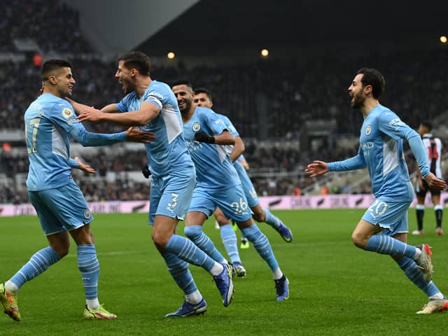 Manchester City players celebrate Ruben Dias’s opener. Credit: Getty.