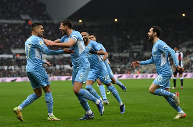 Manchester City players celebrate Ruben Dias’s opener. Credit: Getty.