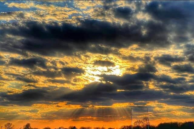 A dramatic sunset over the sports pitches at Hough End Fields