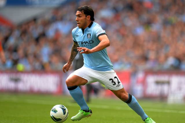 Carlos Tevez in action for Manchester City in 2013 Credit: Getty
