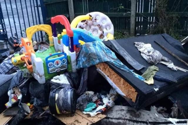 Possessions ruined by the flooding piled up outside Keri Muldoon’s home