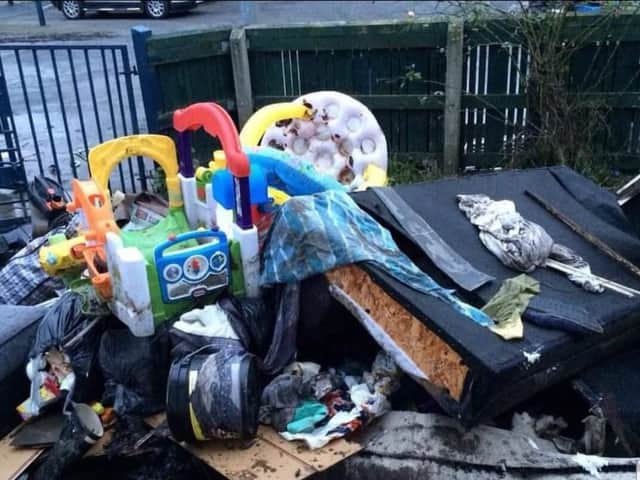 Possessions ruined by the flooding piled up outside Keri Muldoon’s home