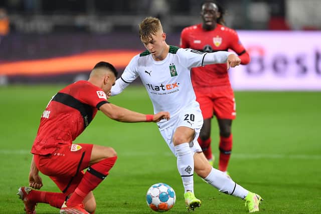 Konstantinos Mavropanos of VfB Stuttgart battles for possession with Luca Netz of Borussia Moenchengladbach during the Bundesliga match between Borussia MÃ¶nchengladbach and VfB Stuttgart