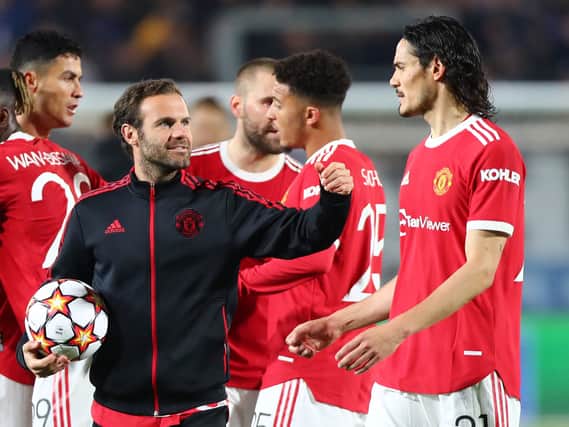 Juan Mata and Edinson Cavani of Manchester United celebrate after the UEFA Champions League group F match between Atalanta and Manchester United at Gewiss Stadium on November 02, 2021