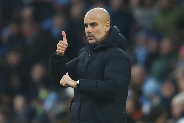 Manchester City manager Josep Guardiola gestures from the touchline during the Premier League match between Manchester City and Leicester City at Etihad Stadium on December 26, 2021