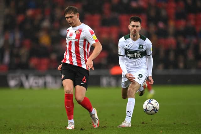 Sunderland player Callum Doyle in action as Ryan Hardie looks on during the Sky Bet League One match between Sunderland and Plymouth Argyle at Stadium of Light on December 11, 2021 in Sunderland, England.