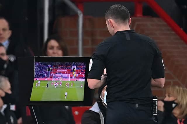 Michael Oliver ruled out Villa’s goal after a lengthy pause. Credit: Getty.