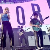 Zac Farro, Hayley Williams, and Josh Farro of Paramore perform onstage in California (Photo: Alberto E. Rodriguez/Getty Images for CBS Radio Inc.)