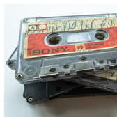A stack of the Tape Letters cassettes bearing messages British-Pakistani families prepared for their relatives