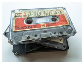 A stack of the Tape Letters cassettes bearing messages British-Pakistani families prepared for their relatives