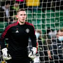 Dean Henderson of Manchester United warms up ahead of the Premier League match between Norwich City and Manchester United at Carrow Road on December 11, 2021 in Norwich, England