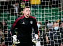 Dean Henderson of Manchester United warms up ahead of the Premier League match between Norwich City and Manchester United at Carrow Road on December 11, 2021 in Norwich, England