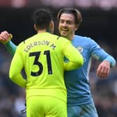  Jack Grealish embraces Ederson as Man City go 11 points clear Credit: Getty