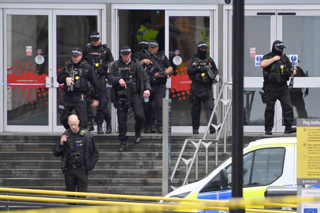  Armed police officers leave the Arndale Centre on October 11, 2019 in Manchester Credit: Getty