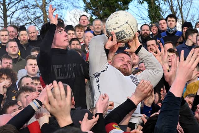 Mob football matches still take place in some UK locations, with the annual 2-day game in Ashbourne, Derbyshire involving thousands of people (image: AFP/Getty Images)