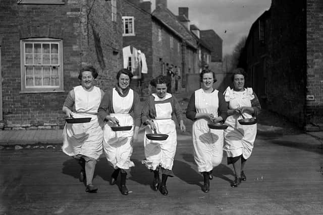 The annual pancake race in Olney, Buckinghamshire has been taking place for centuries (image: Getty Images)