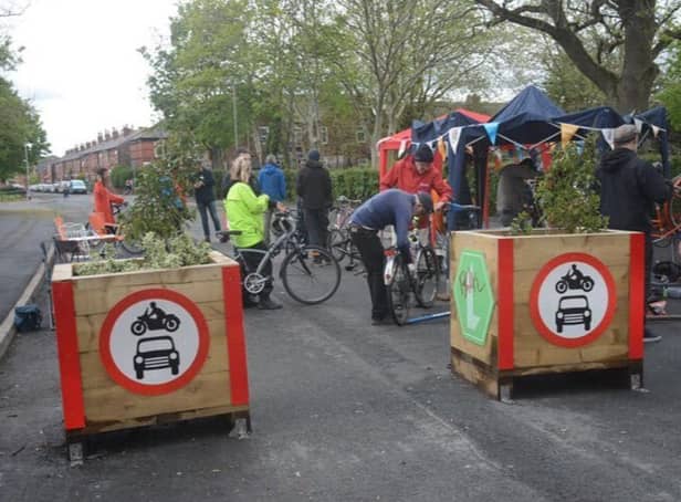 <p>A cycle repair event being held at the LTN filters on Manor Road in Levenshulme</p>
