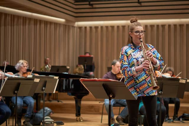 Saxophonist Jess Gillam rehearsing with the Manchester Camerata. Photo: Duncan Elliott