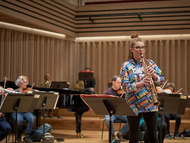 Saxophonist Jess Gillam rehearsing with the Manchester Camerata. Photo: Duncan Elliott