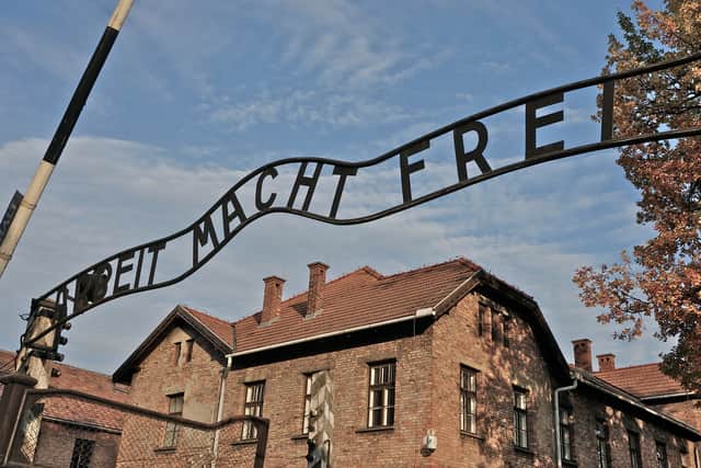 The entrance to the Auschwitz I German Nazi concentration and extermination camp, with the motto ‘Arbeit macht frei’ (‘Work brings freedom’) over the gateway. Photo; Richard Blanshard/Getty Images