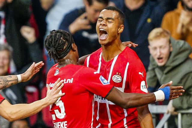 PSV Eindhoven's Cody Gakpo (C) celebrates 3-0 during the UEFA Champions League - third qualifying round match PSV against FC Jyllands in Eindhoven on August 3 2021