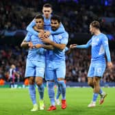 Joao Cancelo celebrates with Phil Foden and Ilkay Gundogan. Credit: Getty.
