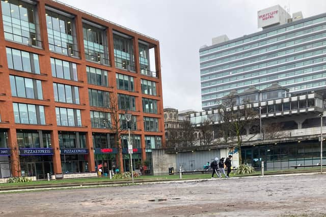 Piccadilly Gardens looking muddy Credit: Simon Binns