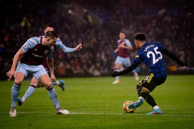 Jadon Sancho of Manchester United in action with James Tarkowski of Burnley during the Premier League match between Burnley and Manchester United at Turf Moor