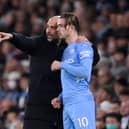 Pep Guardiola and Jack Grealish. Credit: Getty.
