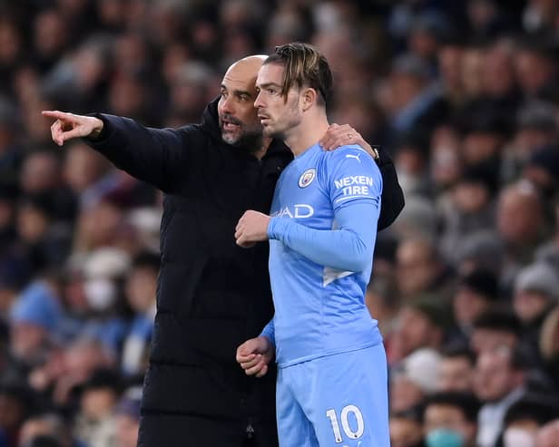 Pep Guardiola and Jack Grealish. Credit: Getty.