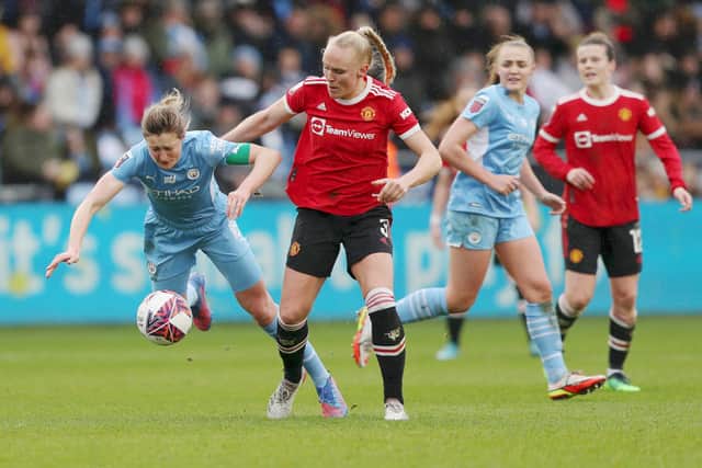 Maria Thorisdottir of Manchester United tackles Ellen White of Manchester City  Credit: Getty