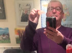 Paul Bishop, 63, said he thought it was a joke when an envelope carrying his missing teeth, covered in Spanish postmarks, turned up on his door yesterday Credit: SWNS