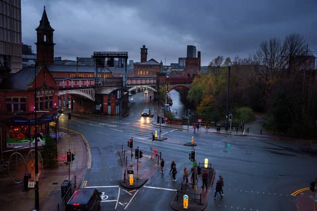 A rainy Deansgate in Manchester: Storm Dudley could bring more downpours and wind this week Credit: Getty