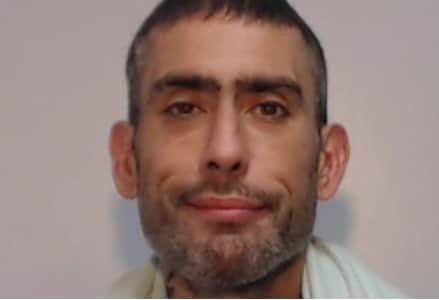 Lee Ullah, 47, has been jailed for burglarly after being found hiding in a bin in Oldham Credit: GMP