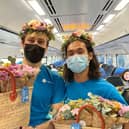 Flowers being given out on a Northern train