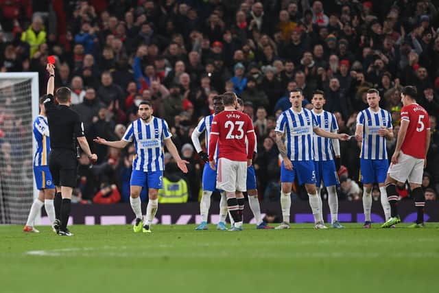 Peter Bankes gives a red card to Brighton’s English defender Lewis Dunk Credit: AFP via Getty Images