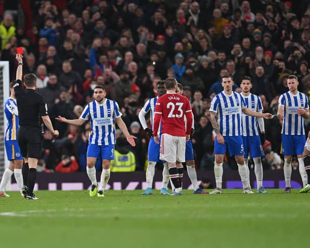 Peter Bankes gives a red card to Brighton’s English defender Lewis Dunk Credit: AFP via Getty Images